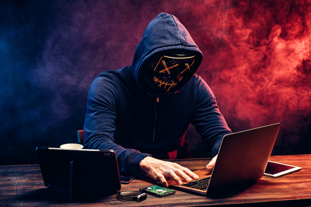 hacker man typing on laptop, hacking computer system