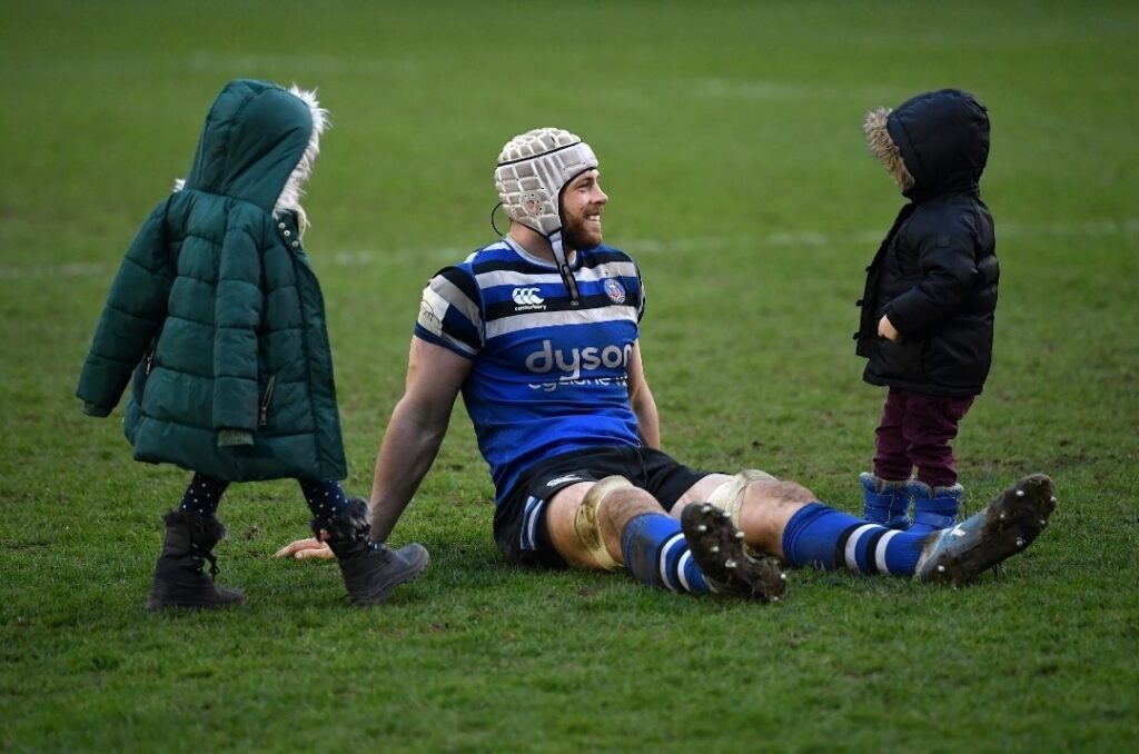 What Value Can The Sport Of Rugby Really Bring To The World Of Business? DAVE ATTWOOD with his children Jess & Patch on the playing filed at Bath Rugby.