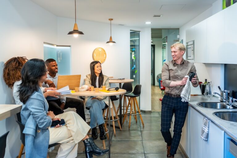 Coworkers chatting and having a coffee