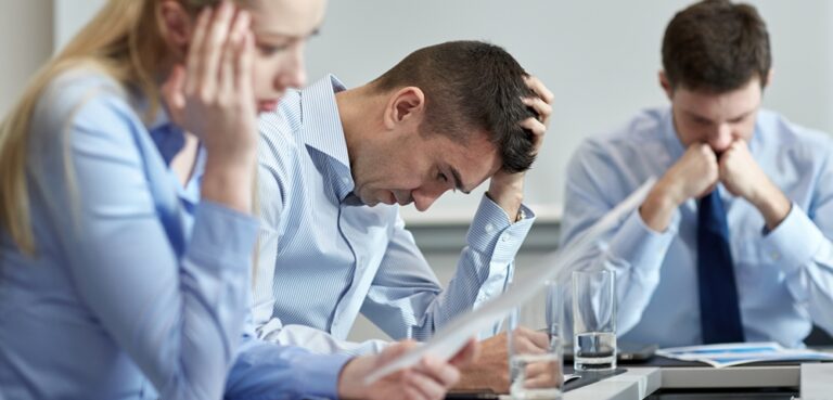 unhappy workers in office